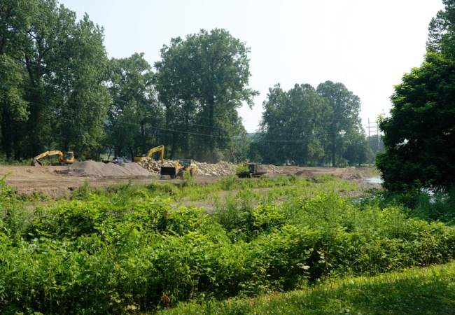 Construction vehicles moving dirt at the Valley View Area.