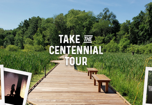 A boardwalk extends along Alder Trail at Goodyear Heights Metro Park. The words, "Take the Centennial Tour" are in bold white letters in the center of the image. Other smaller images of parks and visitors are in the lower corners, and the park district's centennial logo is in an upper corner.