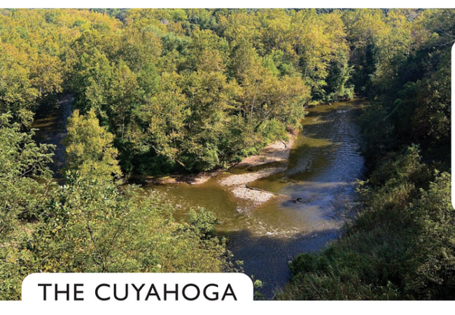 An overlook view of the Cuyahoga River as it bends through the forest.