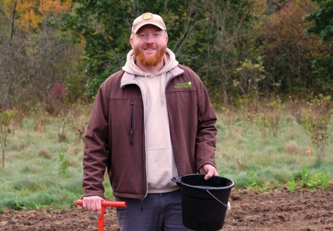Summit Metro Parks Biologist Chris Chaney at a tree planting program.