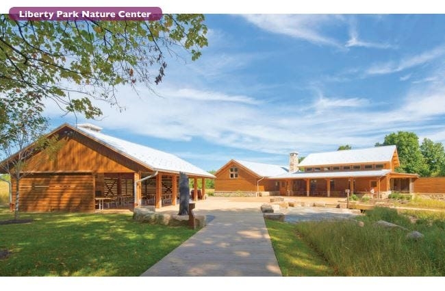 A wide shot of Liberty Park Nature Center and accompanying shelter.