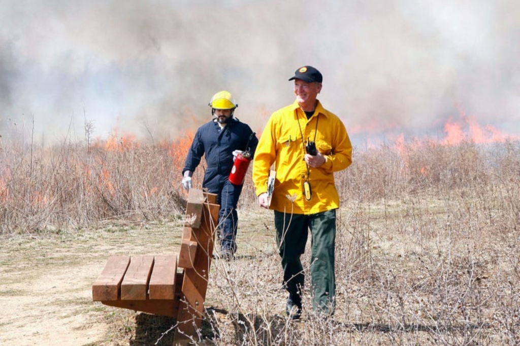 SMP Project Manager Eric Fitch (front) and Chief of Natural Resources Mike Johnson at a prescribed burn in Springfield Bog Metro Park (photo by volunteer Jerry Cannon)