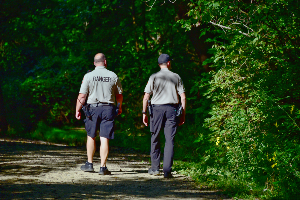Two Summit Metro Parks rangers patrol a trail at Firestone Metro Park on foot. Photo by Joe Prekop.