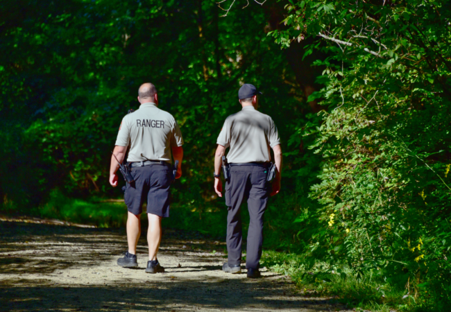 Two Summit Metro Parks rangers patrol a trail at Firestone Metro Park on foot. Photo by Joe Prekop.