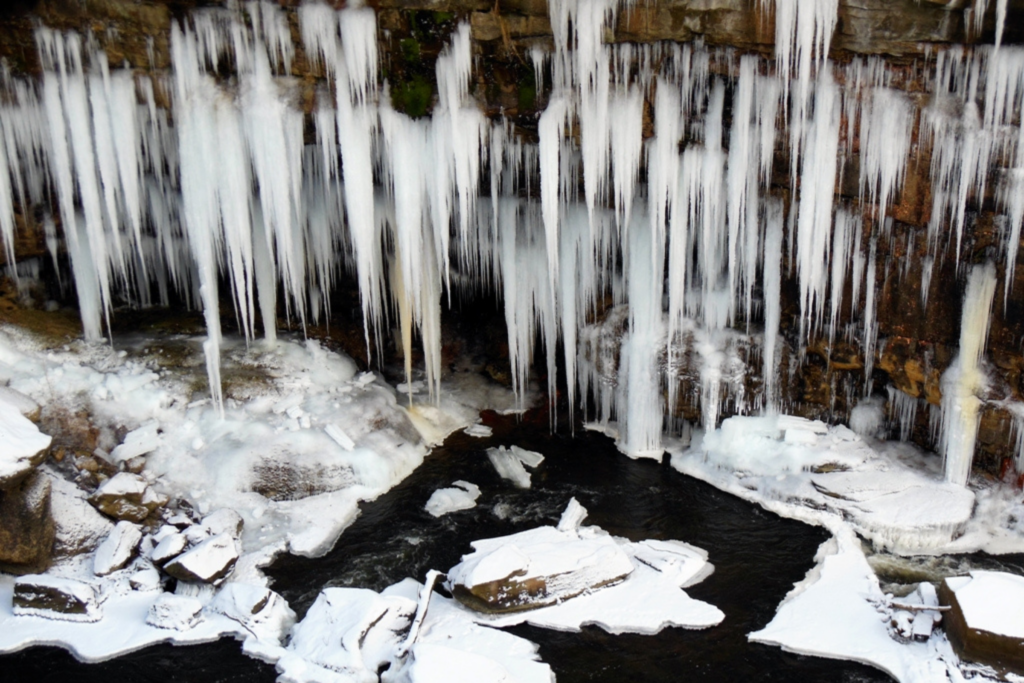 hundreds of icicles hang down toward the Cuyahoga River along Glens Trail