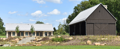 An outdoor shelter and restroom building at the Valley View Area of Cascade Valley Metro Park.