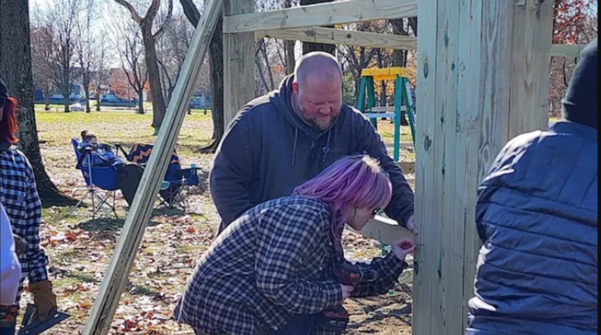 Volunteers complete a bench and windbreak as part of an Eagle Scout project at Goodyear Heights Metro Park.