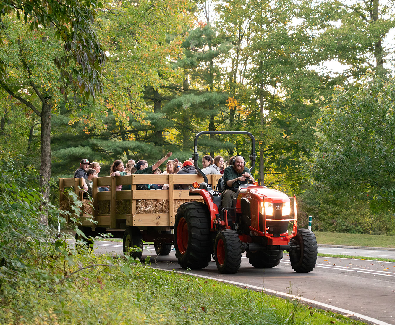 Tractor pulling a group of children on a hayride