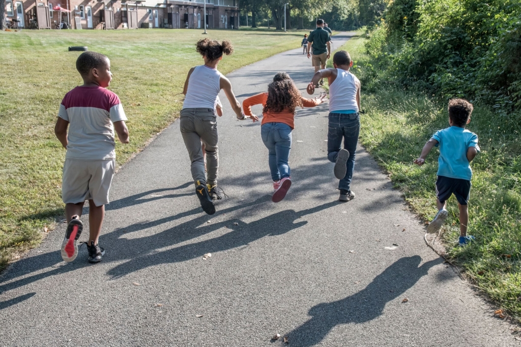 group of kids running up the Towpath Trail near Summit Lake Nature Center