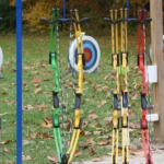 A group of targets and bows set up for archery