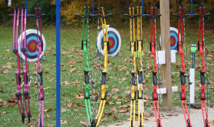 A group of targets and bows set up for archery